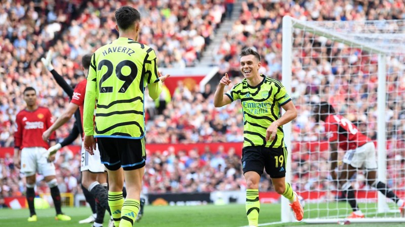 Leandro Trossard of Arsenal celebrates scoring his team's first goal with teammate Kai Havertz during the Premier League match between Manchester United and Arsenal FC at Old Trafford  Image credit: Getty Images